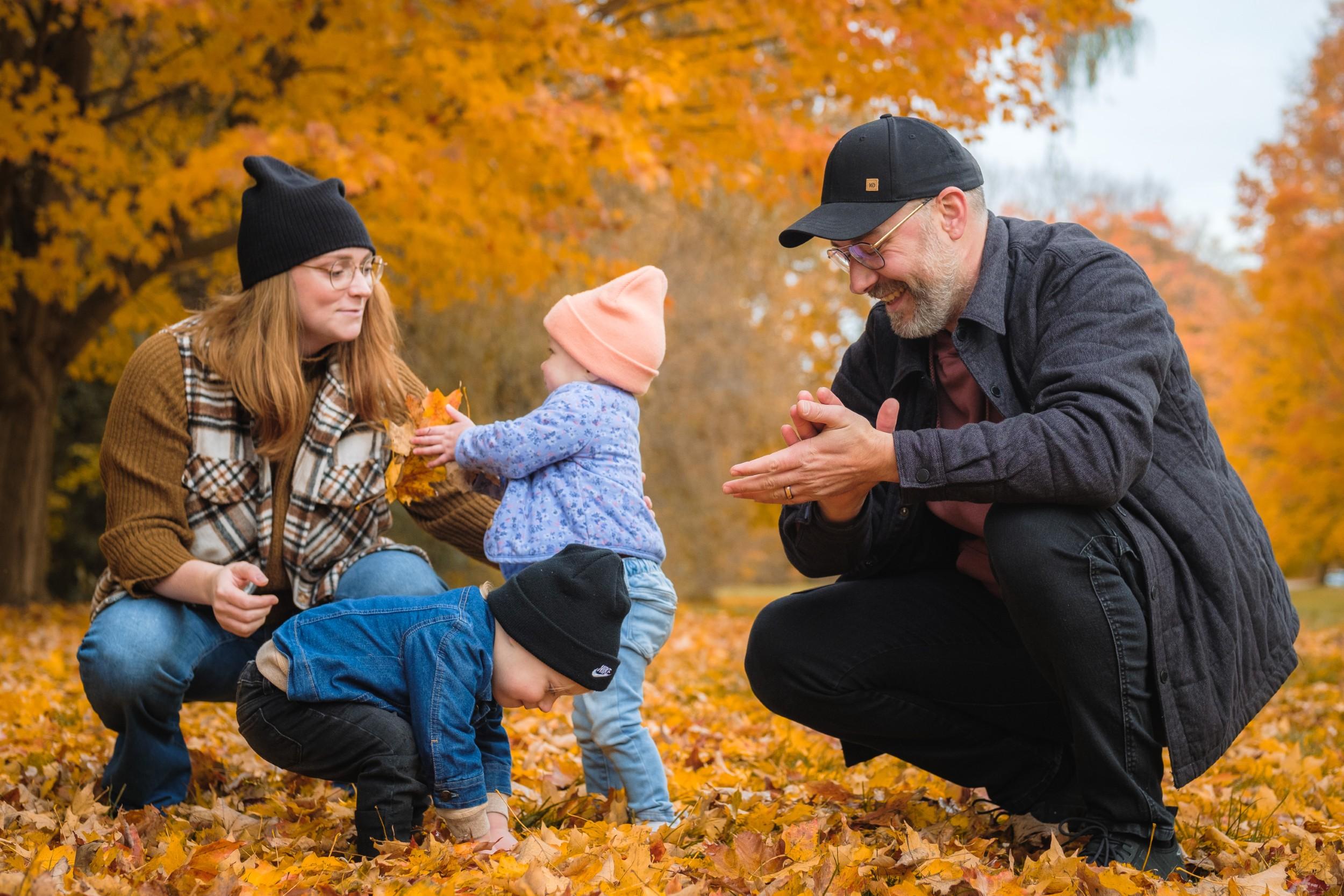 Joyful family laughing together outdoors